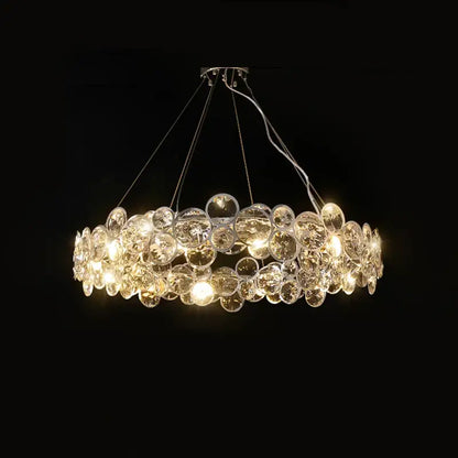 A modern pendant light featuring clear glass orbs in overlapping layers from decorbites crystal magic ring series
