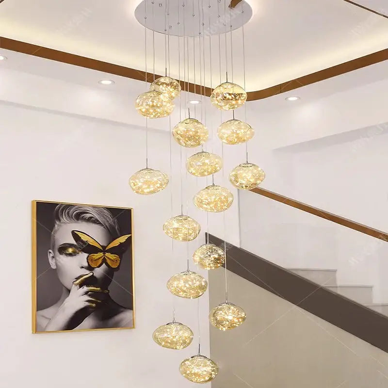 A modern pendant light with golden textured glass orbs and led bulbs for living room led illumination
