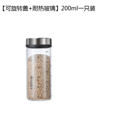 Modern glass seasoning spice shaker salt with clear glass, silver rotating lid, and measurement markings for kitchen use