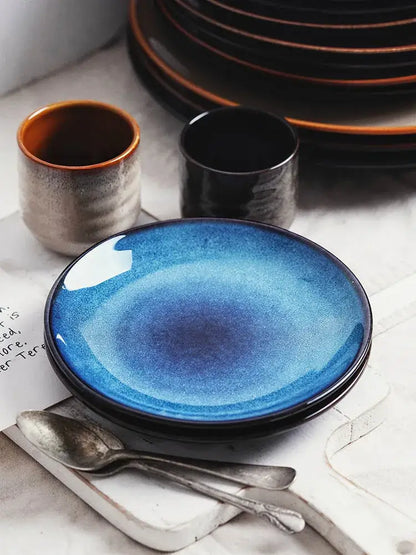 A vibrant blue decorbites ceramic round plate with gradient glaze and subtle speckled texture for dining use