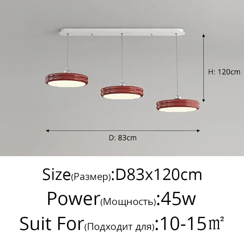 Red glossy circular pendant lights hang from a white mount in modern glossy pale yellow circular dimmable pendant decorbites design