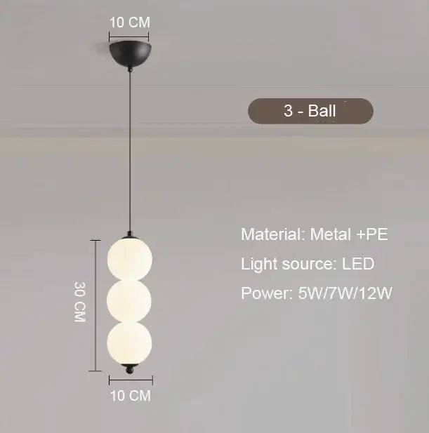 Modern gold 4 globe pendant light with black metal frame, plated gold-toned surface, and frosted white spheres as focal point
