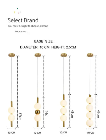 Modern gold 4 globe pendant light with frosted glass spheres and plated gold-toned surface as a dining room focal point