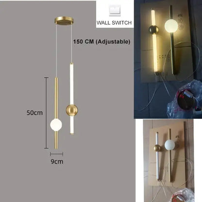Modern gold 4 globe pendant light with plated gold-toned surface and adjustable rod as a dining room focal point