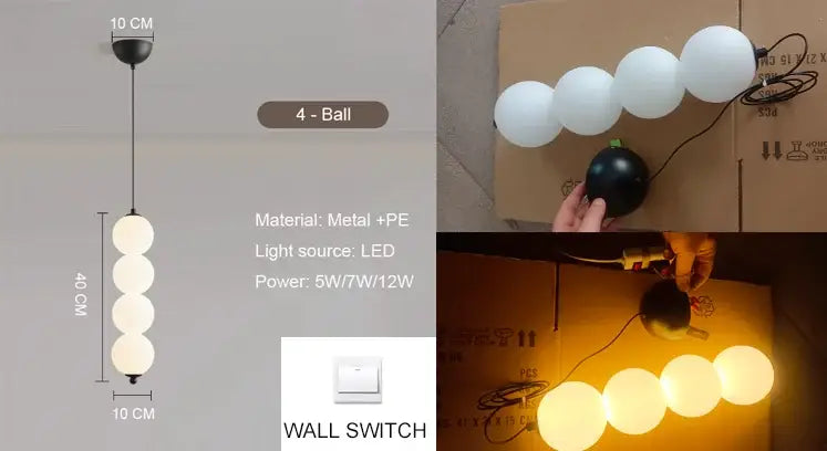 Modern white spherical pendant light with four glowing orbs and plated gold-toned surface as dining room focal point