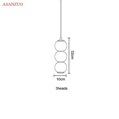 Modern gold Asanzuo three-head pendant light with spherical glass shades and slender rod for dining room decorbites glass ball pendant