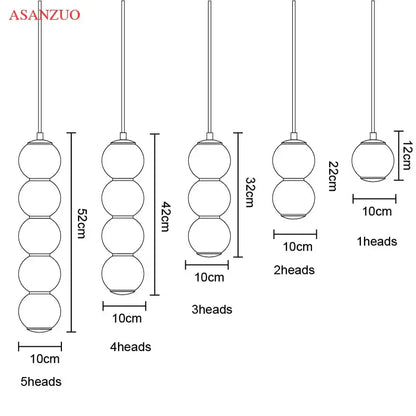 Modern gold asanzuo pendant lights with five glass ball pendant shades in a cascading design for dining room decorbites glass ball