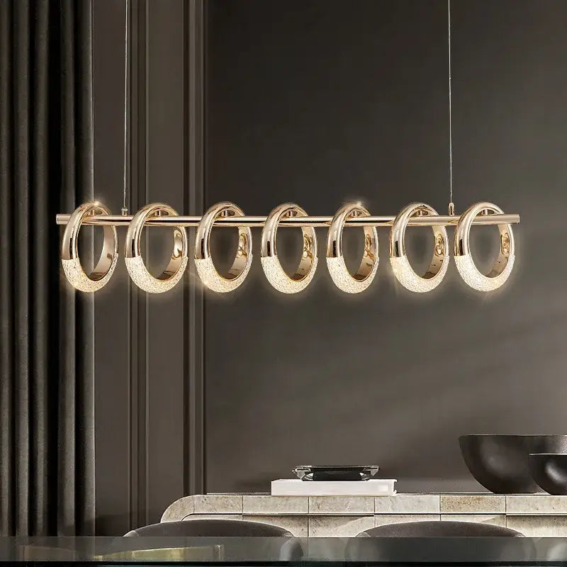 Modern gold acrylic led 6 ring pendant lights with six circular rings emitting warm glow for dining room use