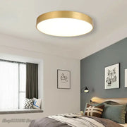 Modern gold acrylic led ceiling light with a round gold metallic frame and white illuminated center for living room