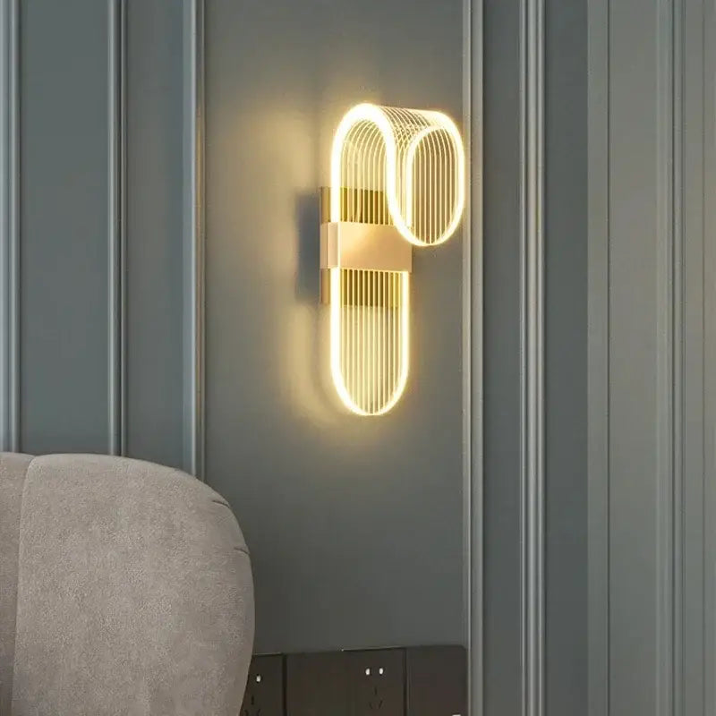 Modern gold acrylic lustre wall sconce with sleek curved design and vertical light strips for decorbites acrylic lustre decor