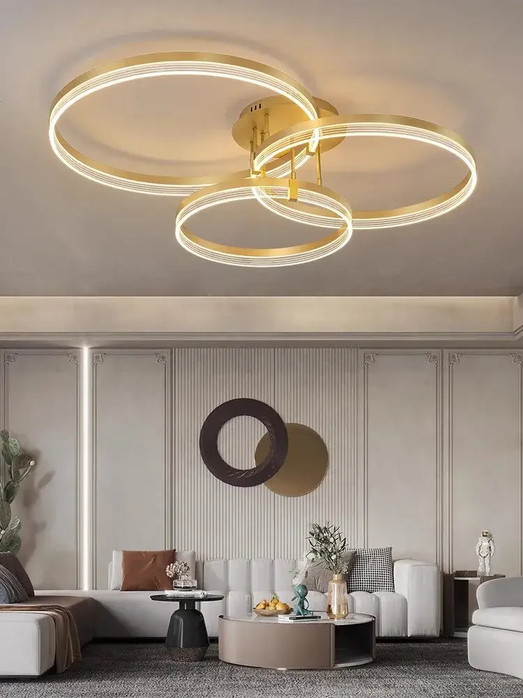 Modern gold acrylic round ring ceiling light with sleek intertwined design for living room decorbites acrylic round ring