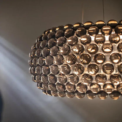 Modern gold acrylic rs7 bulb pendant lights with dark amber glass orbs for elegant dining room decorbites acrylic rs7 bulb chandelier