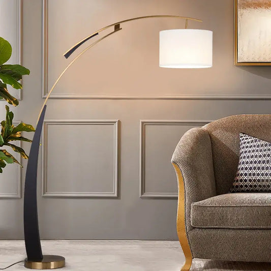 A sleek modern decorbites adjustable metal floor lamp with a curved gold frame and white fabric shade for living room decor