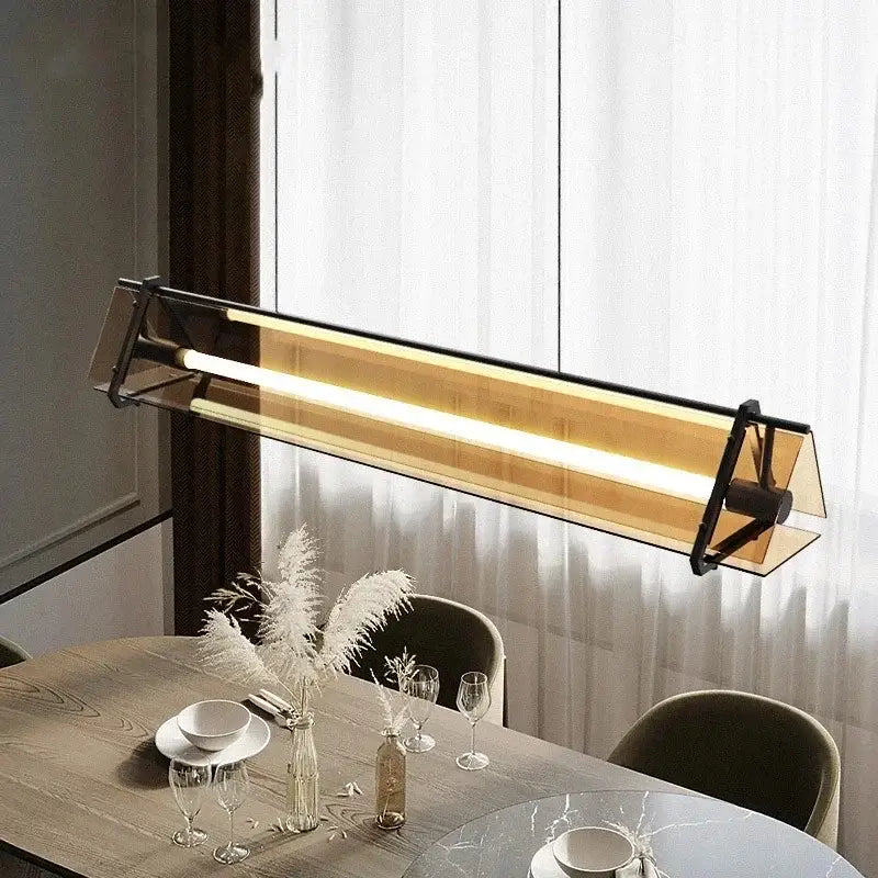 Modern gold amber led pendant lamp with black metal frame and translucent amber glass for dining room decorbites amber led