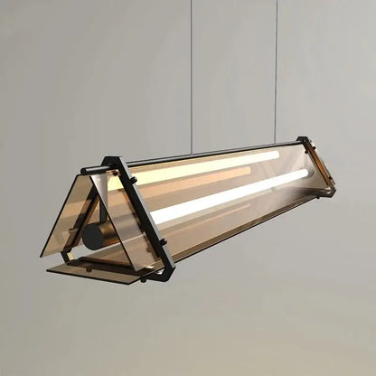 Modern gold amber led pendant lamp with sleek black metal frame and translucent glass for dining room decorbites amber led