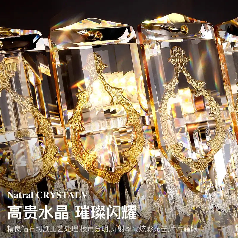 Modern gold and amber decorbites crystal chandelier with faceted clear crystals and intricate gold-toned designs for dining room light