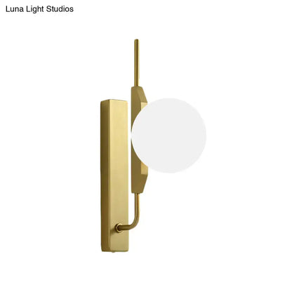 Modern gold and amber glass orb light fixture with frosted globe shade and rectangular backplate for 110v-120v use