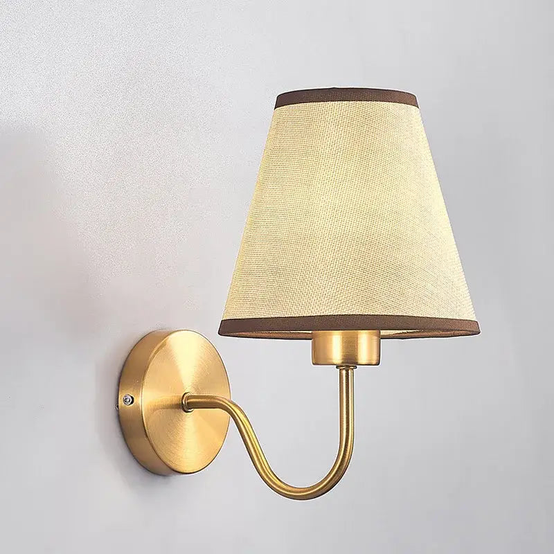 Modern gold and beige cloth led wall lamp with brass finish and beige textured fabric shade with dark brown trim decorbites cloth led