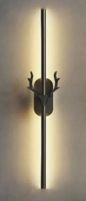 Modern black metal wall lamp with sleek vertical design and decorbites deer horn led motif for bedroom sconce decor