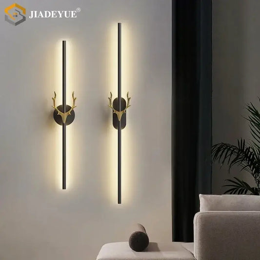 Modern gold and black wall lamp with decorbites deer horn led design featuring gold-toned deer head and black bars