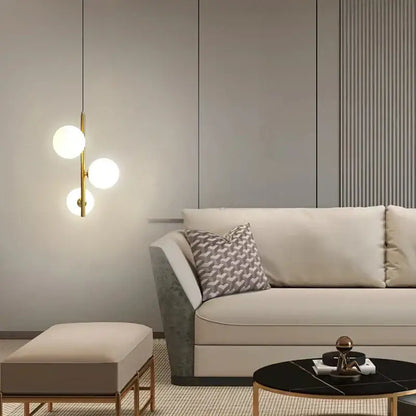 Modern gold and black pendant light with three gold-toned glass ball led bulbs for bedroom hanging lamp lighting