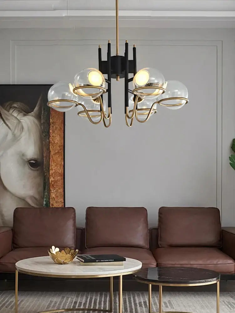 Modern gold and black glass ball pendant light with metal arms and clear glass globes for living room decorbites pendant light