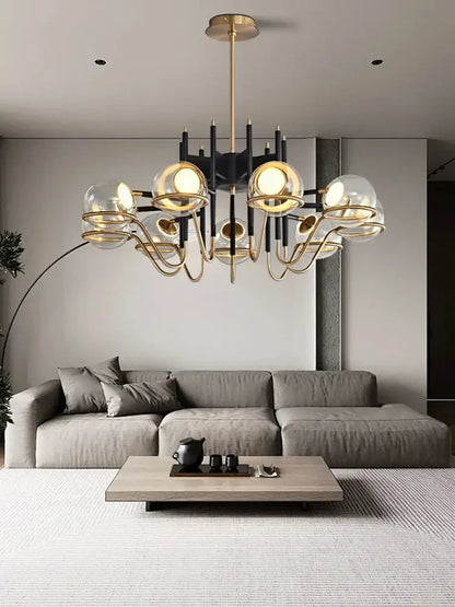 Modern gold and black glass ball pendant light featuring gold-toned metal arms and spherical glass globes for living room decorbites glass ball pendant