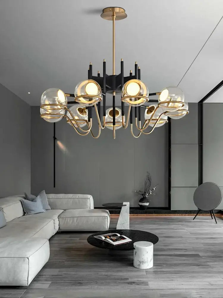 Modern gold and black glass ball pendant light with multiple spherical shades and black arms for living room decorbites