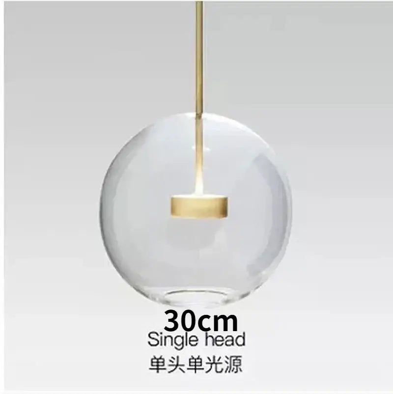 Modern gold and black glass chandelier featuring a clear glass globe pendant light with a gold-toned metal stem decorbites glass chandelier