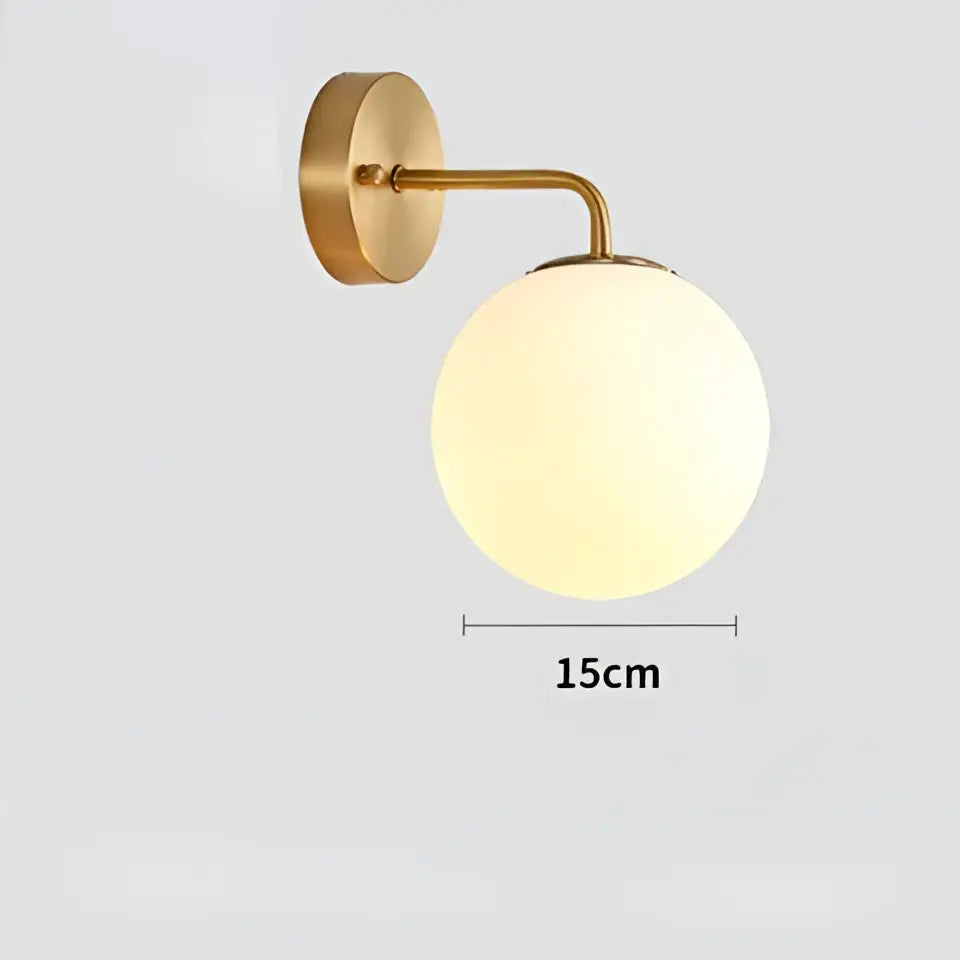 Modern gold and black led glass ball wall lights with gold-toned wall sconce and frosted glass globe by decorbites brozen black