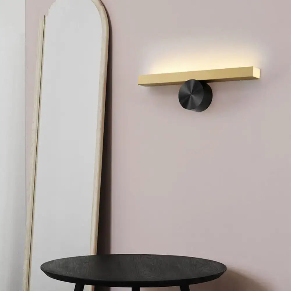 Modern gold and black linear wall light fixture with a sleek gold bar and matte black base for 110v-120v use
