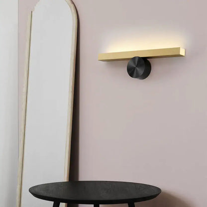 Modern gold and black linear wall light fixture with a sleek gold bar and matte black base for 110v-120v use