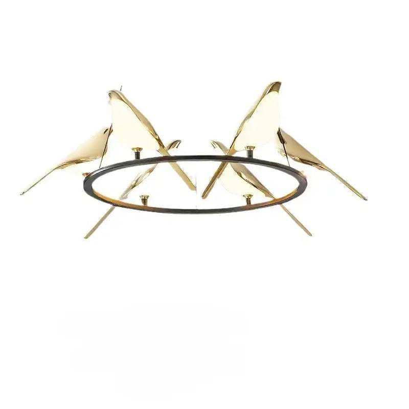 Modern gold and black magpie bird pendant light with gold-toned iron finish and cord pendant installation circular base