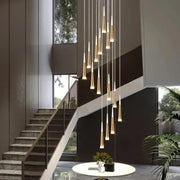Modern gold and black stair chandelier with sleek tapered cylindrical shades for decorbites black stair lighting