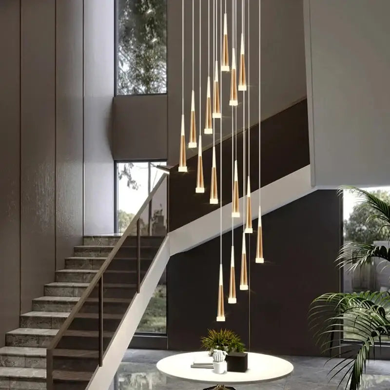 Modern gold and black stair chandelier with sleek tapered cylindrical shades for decorbites black stair lighting
