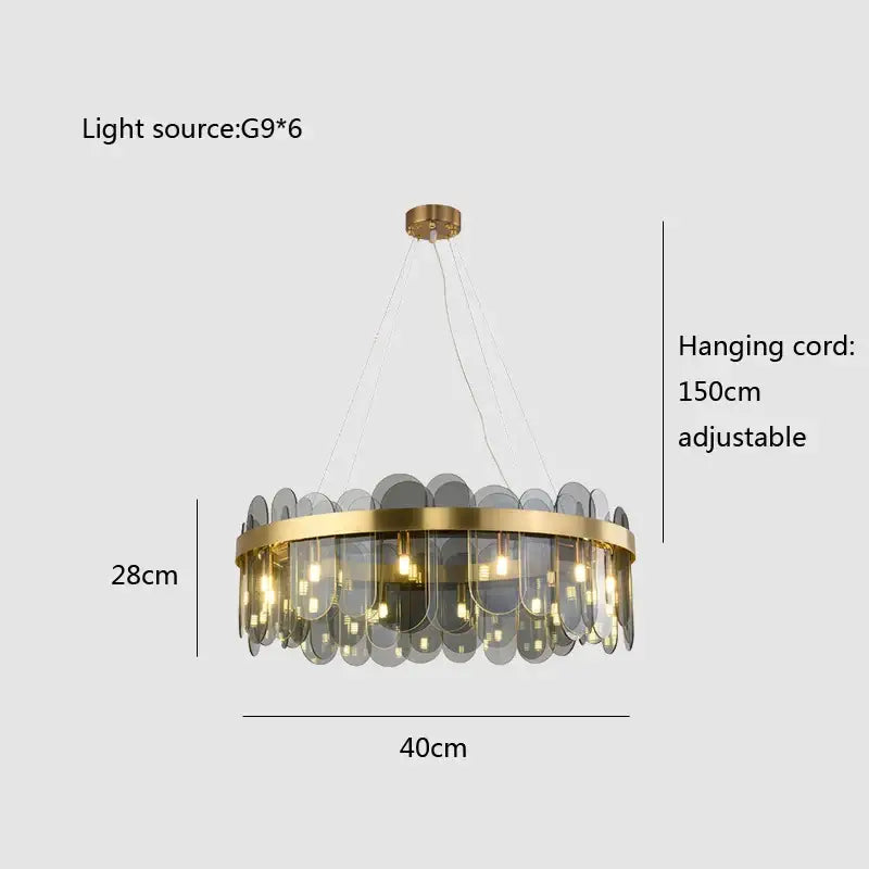 Modern gold and blue glass chandelier with circular frame and translucent gray discs as dining table lighting solution