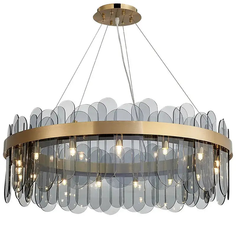 Modern gold and blue glass chandelier with translucent gray leaf-shaped shades provides elegant dining experience lighting solution