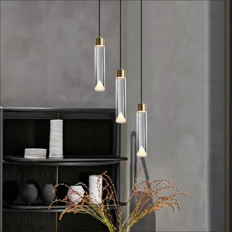 Modern gold and clear crystal copper pendant light with three clear glass cylinders and warm white led bulbs for dining room decorbites clear crystal