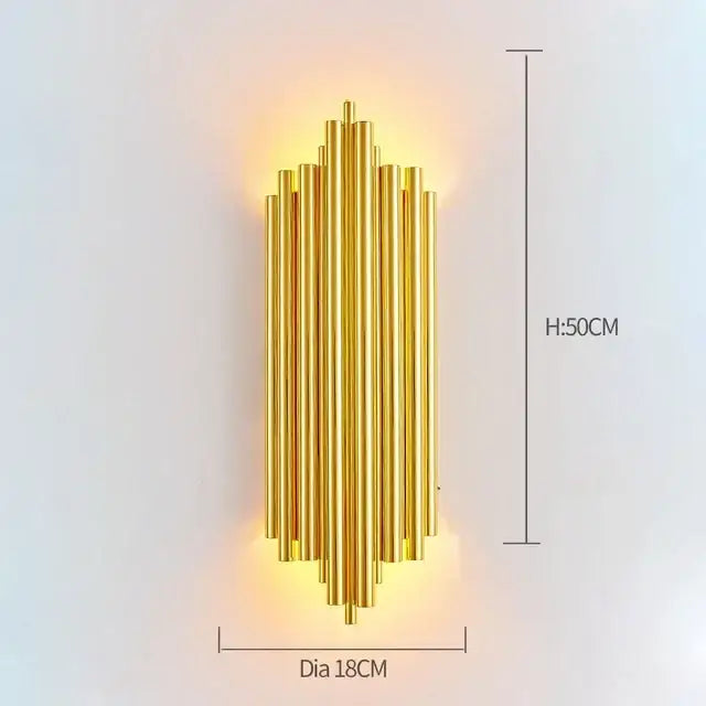 Modern gold and clear glass led wall lamps featuring a golden metallic sconce with vertical cylindrical rods in a symmetrical radiating pattern