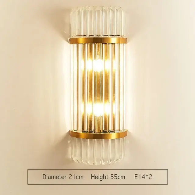 Modern gold and clear glass led wall lamps featuring vertical crystal rods and a warm glow for bedroom use