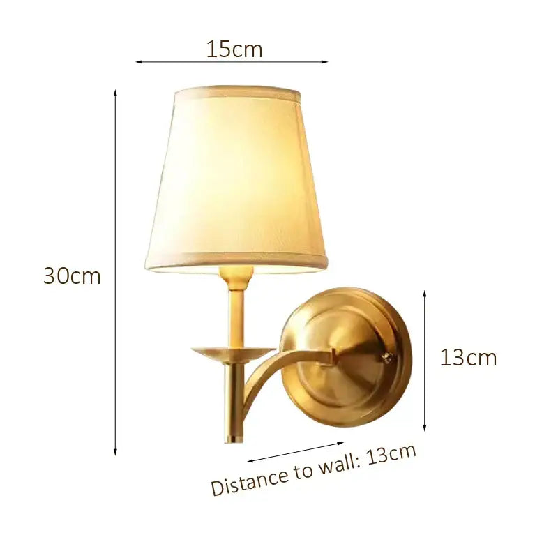 Modern gold and cream fabric wall lamp with brass finish and tapered shade ideal for bedroom decorbites copper wall lamp