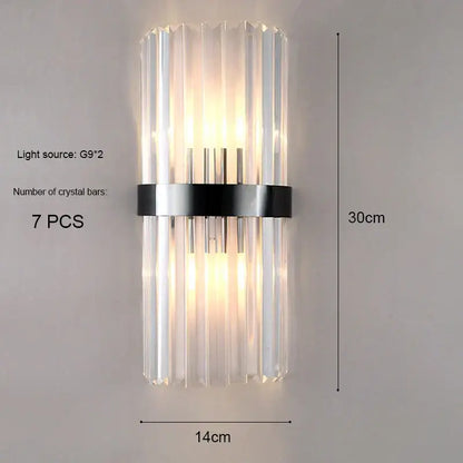 Modern gold and crystal wall light featuring seven clear crystal bars secured by a sleek black metal band for decorbites crystal wall decor