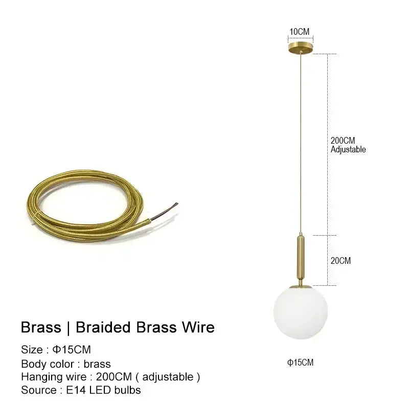 Modern gold pendant light with brass braided wire and frosted glass globe ideal for kitchen island lighting