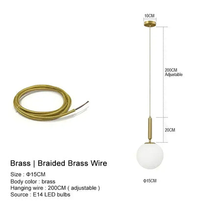 Modern gold pendant light with brass braided wire and frosted glass globe ideal for kitchen island lighting