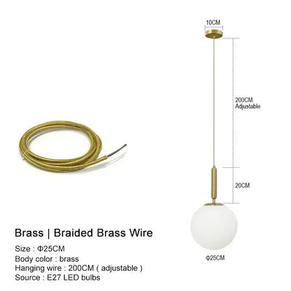 Modern gold and frosted glass globe pendant light with brass hardware ideal for kitchen island lighting