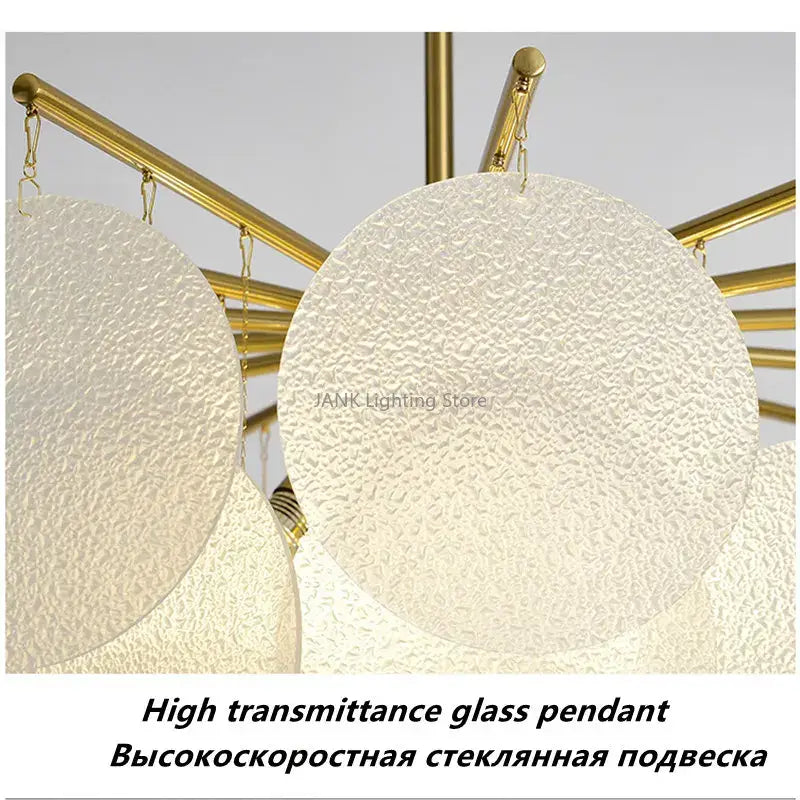 Modern gold led chandelier with frosted textured glass discs hanging from central rod for dining room lighting