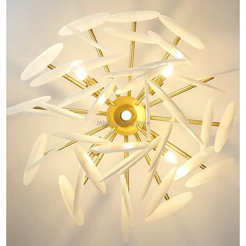 Modern gold and frosted glass led chandelier with translucent petal-like shades for dining room lighting
