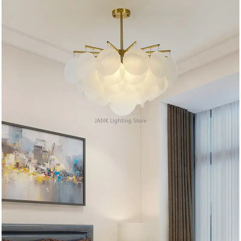Modern gold led chandelier featuring frosted glass cloud-shaped shades for dining room lighting