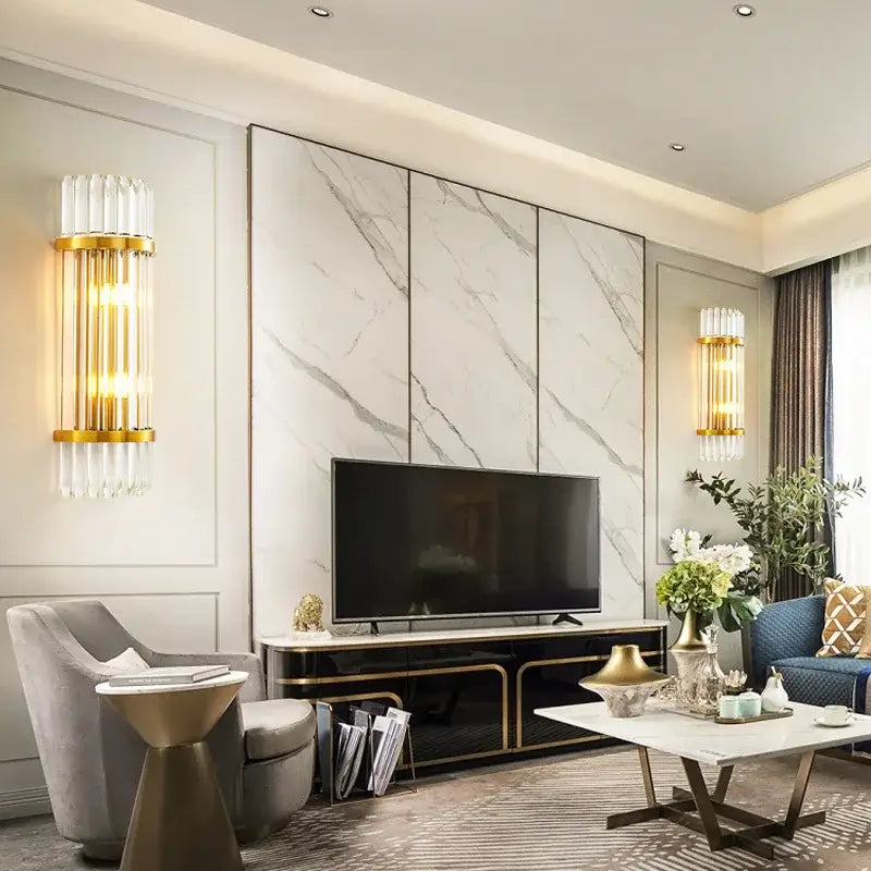 Modern gold and glass led wall lamps with vertical crystal tubes providing warm ambient lighting for bedroom walls