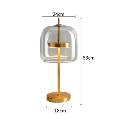 Modern gold and gray glass table lamp with clear glass dome and gold-toned metal frame for bedroom decorbites decor